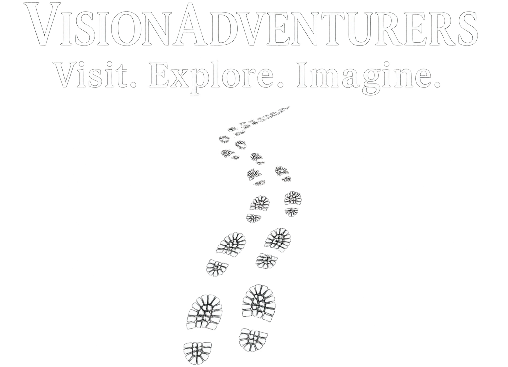 Vision Adventurers logo The website logo has the name Vision Adventurers in bold caps. Immediately under this text is the site’s tagline Visit. Explore. Imagine. The final element is an image of winding footprints moving toward the text from below. The steps signify life’s winding road and the Vision Adventurer’s journey.